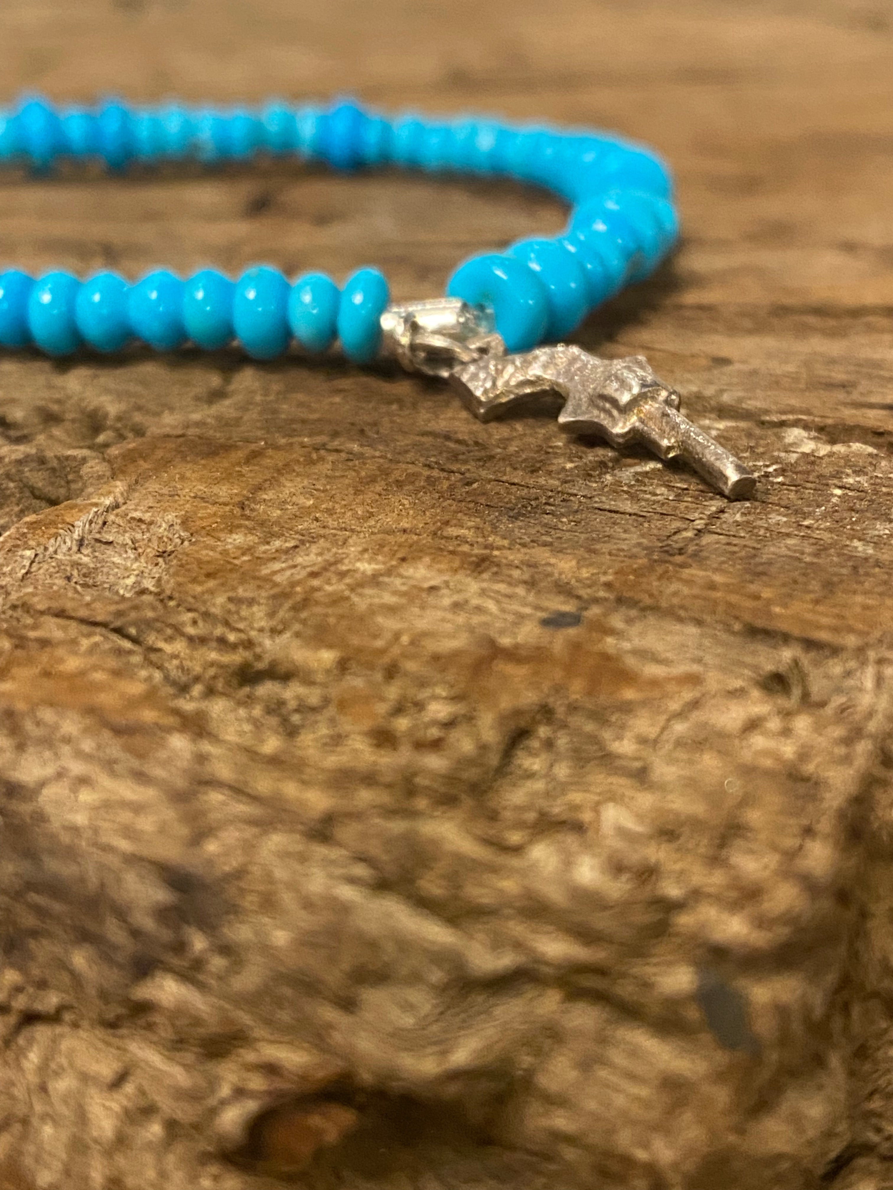 Sleeping Beauty Turquoise Mixed Rondelle Bead Stretch Bracelet with Sterling Silver Pistol Charm