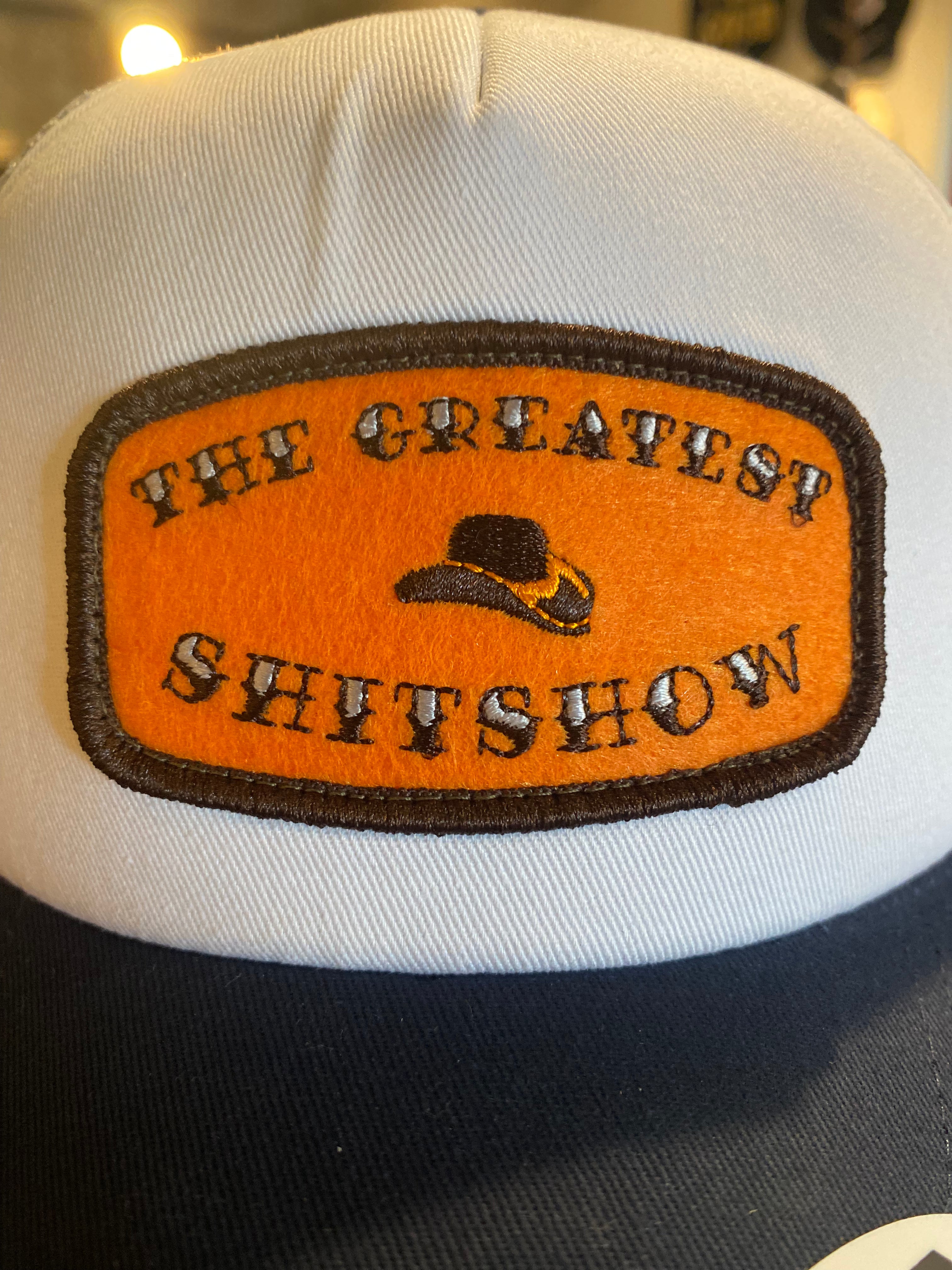 The Greatest $h!t$how - Orange Patch on White/Grey/Navy Trucker